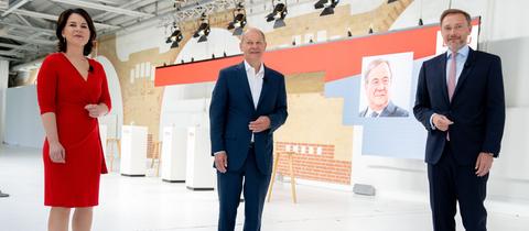 Annalena Baerbock (Grüne), Olaf Scholz (SPD) und Christian Lindner (FDP) bei einer Diskussionsrunde
