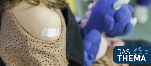 Sujetbild: Ein Kind hat nach einer Impfung ein Pflaster auf der Schulter